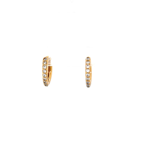 The Rose gold Zirconia stones Huggies earrings are crafted in a huggie-style design, featuring elegant rose gold hoops adorned with small sparkling zirconia. Set against a plain white background, these 14k rose-filled metal treasures exude timeless charm.